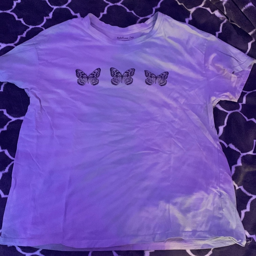 it’s a multi color shirt with butterfly’s on it